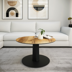 Table basse Pégase pied en acier coloris carbone plateau chêne clair dans un salon